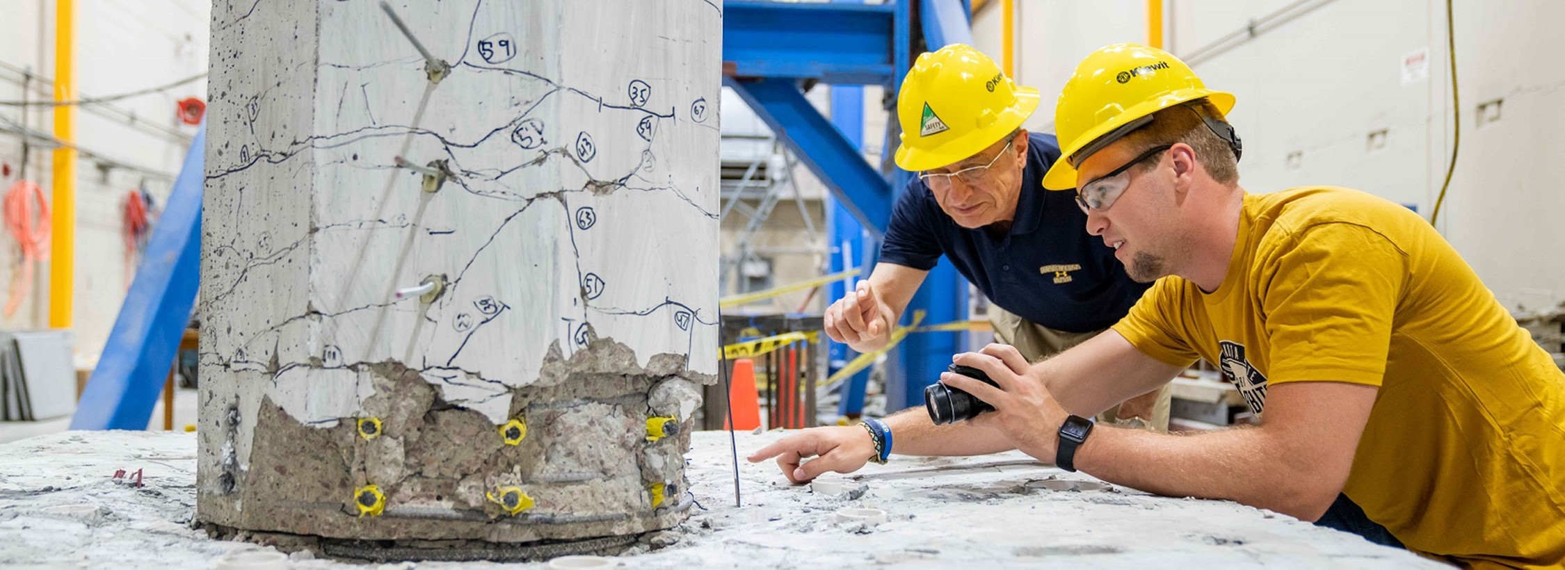 View of a professor and student working in the structural civil engineering lab.